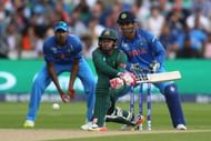 BIRMINGHAM, ENGLAND - JUNE 15: Mushfiqur Rahim of Bangladesh reverse sweeps as wicketkeeper MS Dhoni looks on during the ICC Champions Trophy Semi-Final match between Bangladesh and India at Edgbaston on June 15, 2017 in Birmingham, England.  (Photo by Michael Steele/Getty Images)